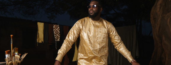 Bogolan in beige on man painting