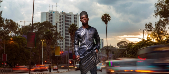 Man in navyblue boubou on urban crossing