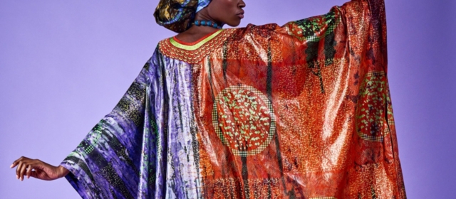 Woman dancing in a colourful Boubou