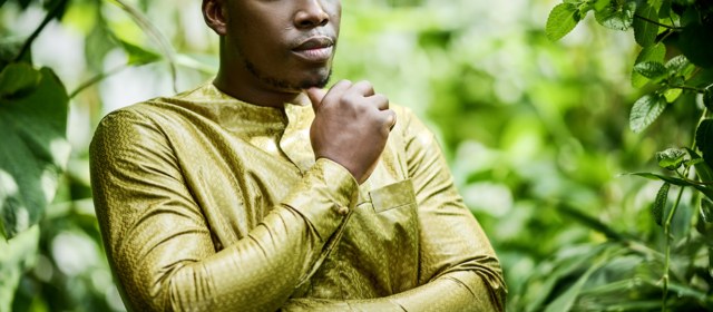 Thoughtful man in yellow boubou